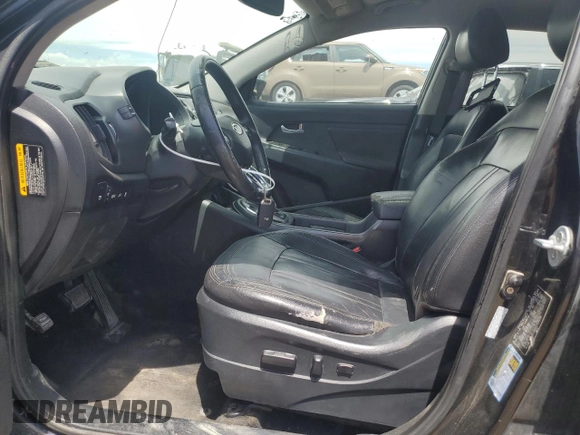 2012 Kia Sportage SX with VIN KNDPC3A60C7176018, listed as a Copart auction lot 57940525 with 201,932 mi miles and Salvage title. Bid and sale history available at DreamBid. Image 7.