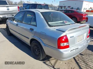 2001 Mazda Protege DX with VIN JM1BJ222810410482, listed as a IAAI auction lot 40799727 with 159,446 mi miles and . Bid and sale history available at DreamBid. Image 3.