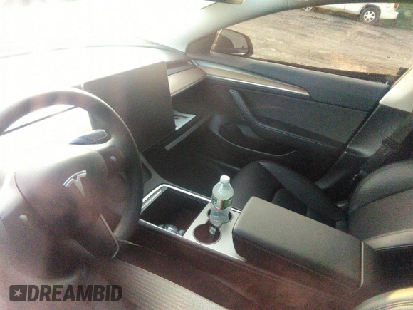 2023 Tesla Model 3 z VIN 5YJ3E1EA3PF449187, wystawiony jako IAAI lot #40320939 z przebiegiem Nie podano mil oraz . Historia ofert i sprzedaży dostępna na DreamBid. Obrazek 13.