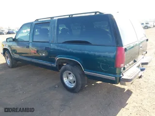 1996 GMC Suburban with VIN 1GDEC16R5TJ742543, listed as a IAAI auction lot 41910103 with 159,469 mi miles. Bid and sale history available at carsss.com. Image 3.