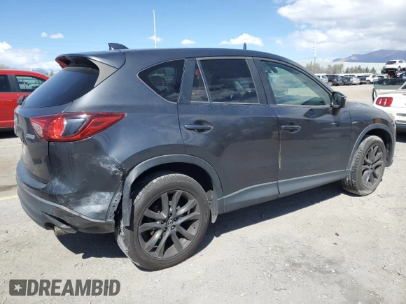 2015 Mazda CX-5 Grand Touring with VIN JM3KE4DY9F0536771, listed as a Copart auction lot 51801775 with 88,529 mi miles and Salvage Title. Bid and sale history available at DreamBid. Image 3.