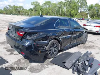 2023 Toyota Camry SE with VIN 4T1G11AK6PU741172, listed as a IAAI auction lot 41599909 with 56,668 mi miles and . Bid and sale history available at DreamBid. Image 4.