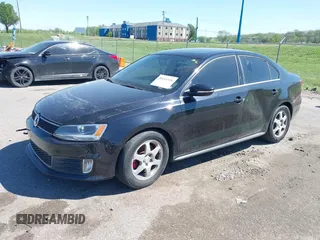 2014 Volkswagen Jetta GLI with VIN 3VW4T7AJ5EM382195, listed as a IAAI auction lot 39211126 with 94,735 mi miles and . Bid and sale history available at DreamBid. Image 2.