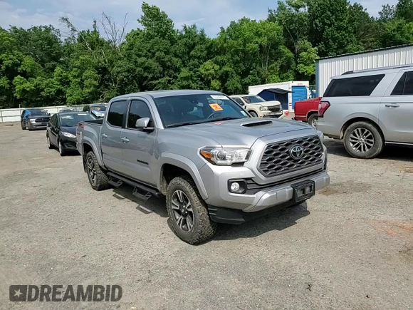 2020 Toyota Tacoma SR5 z VIN 3TMCZ5AN7LM302123, wystawiony jako Copart lot #57299805 z przebiegiem 43 244 mil mil oraz Szkoda całkowita • Salvage title. Historia ofert i sprzedaży dostępna na DreamBid. Obrazek 13.