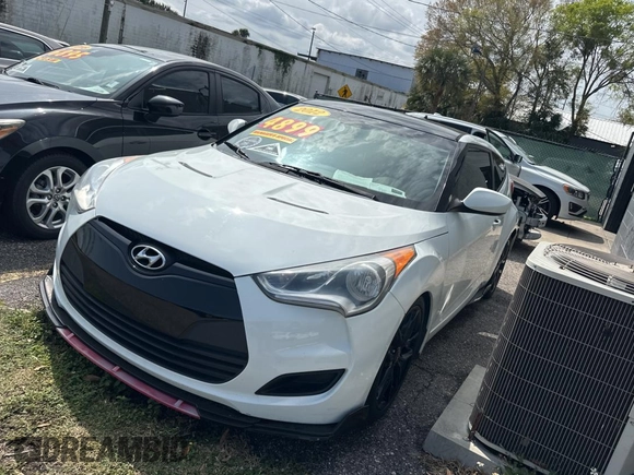 2012 Hyundai Veloster w/Gray Int с VIN KMHTC6AD6CU036826, выставлен на аукционе Copart как лот 48781135 с пробегом 169 498 миль миль и Чистый • Clean title. История ставок и продаж доступна на DreamBid. Изображение 2.