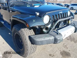 2010 Jeep Wrangler Unlimited Sahara with VIN 1J4HA5H16AL215659, listed as a IAAI auction lot 41749218 with 55,544 mi miles. Bid and sale history available at carsss.com. Image 6.