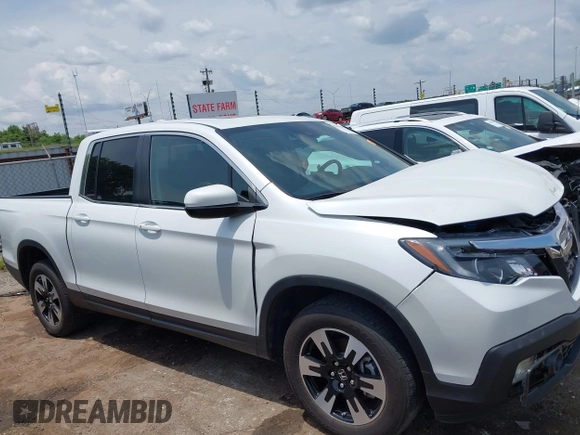 2020 Honda Ridgeline RTL with VIN 5FPYK3F51LB029859, listed as a IAAI auction lot 42462285 with 57,399 mi miles and . Bid and sale history available at DreamBid. Image 14.