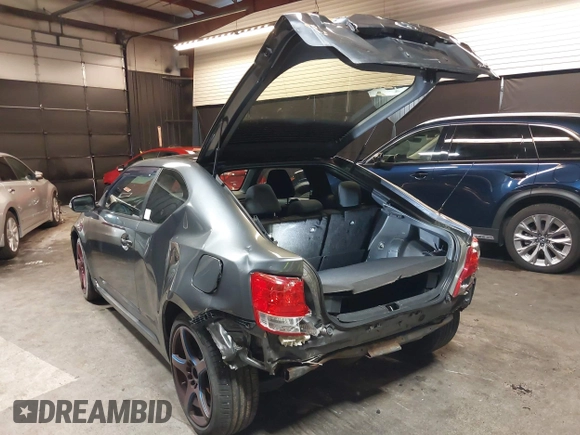 2012 Scion tC with VIN JTKJF5C7XC3034998, listed as a IAAI auction lot 41591632 with 171,121 mi miles. Bid and sale history available at carsss.com. Image 3.