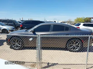 2015 Dodge Charger SXT with VIN 2C3CDXHG4FH890684, listed as a IAAI auction lot 41896958 with 118,140 mi miles and . Bid and sale history available at DreamBid. Image 14.