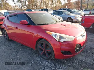 2012 Hyundai Veloster w/Gray Int z VIN KMHTC6AD6CU058180, wystawiony jako IAAI lot #41437903 z przebiegiem 198 066 mil mil oraz . Historia ofert i sprzedaży dostępna na DreamBid. Obrazek 1.