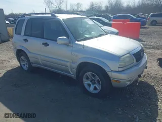 2003 Suzuki Grand Vitara with VIN JS3TD62V734105601, listed as a IAAI auction lot 42046825 with 210,728 mi miles. Bid and sale history available at carsss.com. Image 1.