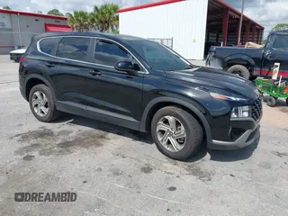 2021 Hyundai Santa Fe SE z VIN 5NMS14AJ0MH332918, wystawiony jako IAAI lot #42365534 z przebiegiem 58 720 mil mil oraz . Historia ofert i sprzedaży dostępna na DreamBid. Obrazek 1.
