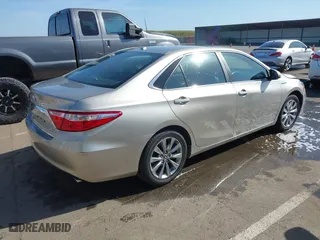 2015 Toyota Camry Hybrid LE with VIN 4T1BD1FK1FU174975, listed as a IAAI auction lot 42085034 with 54,728 mi miles. Bid and sale history available at carsss.com. Image 4.