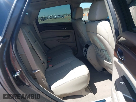 2015 Cadillac SRX Performance Collection with VIN 3GYFNFE35FS569682, listed as a IAAI auction lot 42322229 with 124,365 mi miles and . Bid and sale history available at DreamBid. Image 8.