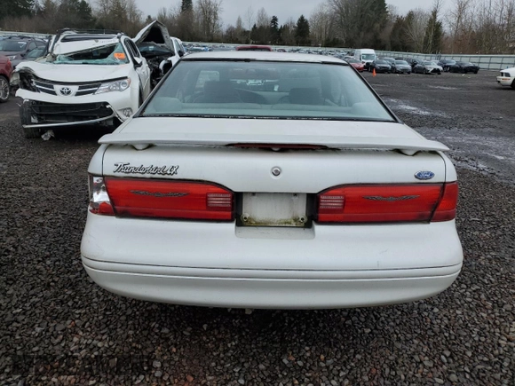 1997 Ford Thunderbird LX z VIN 1FALP62W2VH154138, wystawiony jako Copart lot #46281235 z przebiegiem 145 738 mil mil oraz Tytuł czysty. Historia ofert i sprzedaży dostępna na DreamBid. Obrazek 6.