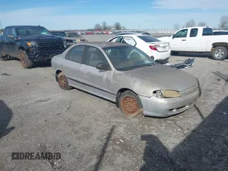 1997 Hyundai Elantra with VIN KMHJF24M3VU424442, listed as a IAAI auction lot 41675970 with 116,809 mi miles and . Bid and sale history available at DreamBid. Image 1.