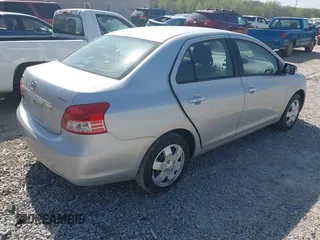 2009 Toyota Yaris with VIN JTDBT903X91301963, listed as a IAAI auction lot 42102283 with 143,966 mi miles. Bid and sale history available at carsss.com. Image 4.