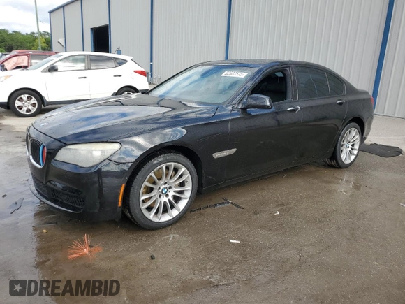 2011 BMW 7 Series 740i with VIN WBAKA4C52BC612977, listed as a Copart auction lot 52582575 with 157,813 mi miles and Salvage Title. Bid and sale history available at carsss.com. Image 1.