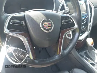 2014 Cadillac SRX Performance Collection z VIN 3GYFNCE35ES517868, wystawiony jako IAAI lot #41775522 z przebiegiem 166 960 mil mil oraz . Historia ofert i sprzedaży dostępna na DreamBid. Obrazek 11.