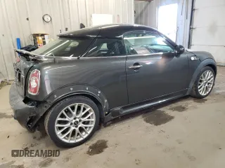 2012 MINI Coupe S z VIN WMWSX3C50CT154835, wystawiony jako Copart lot #76659984 z przebiegiem 122 425 mil mil oraz Szkody całkowita. Historia ofert i sprzedaży dostępna na DreamBid. Obrazek 3.
