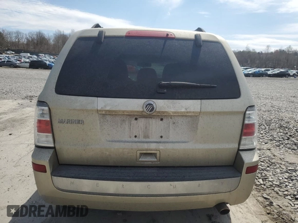 2010 Mercury Mariner z VIN 4M2CN9BG0AKJ17705, wystawiony jako Copart lot #53790315 z przebiegiem 154 832 mil mil oraz Szkody całkowita. Historia ofert i sprzedaży dostępna na DreamBid. Obrazek 6.