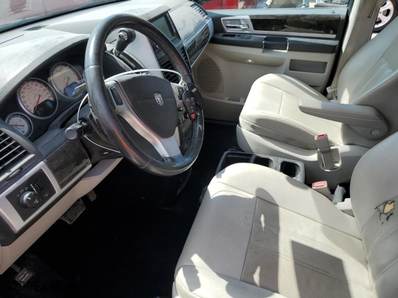 2010 Dodge Grand Caravan SXT with VIN 2D4RN5DXXAR168686, listed as a Copart auction lot 65464994 with 123,340 mi miles and Salvage Title. Bid and sale history available at carsss.com. Image 7.