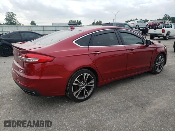 2019 Ford Fusion Titanium z VIN 3FA6P0D99KR221328, wystawiony jako Copart lot #57104515 z przebiegiem 138 427 mil mil oraz Szkoda całkowita • Salvage title. Historia ofert i sprzedaży dostępna na DreamBid. Obrazek 3.