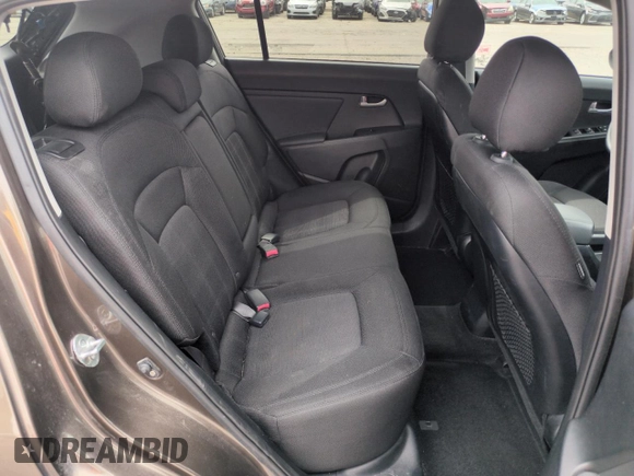 2013 Kia Sportage LX z VIN KNDPBCA29D7458904, wystawiony jako Copart lot #59175745 z przebiegiem 100 719 mil mil oraz Szkoda całkowita • Salvage title. Historia ofert i sprzedaży dostępna na DreamBid. Obrazek 11.