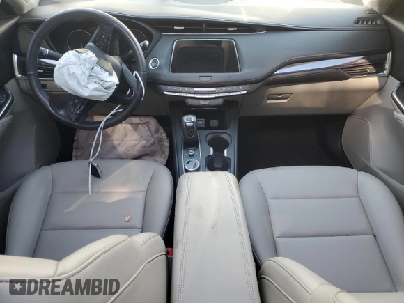 2019 Cadillac XT4 FWD Luxury z VIN 1GYAZAR45KF110798, wystawiony jako Copart lot #58872555 z przebiegiem 31 631 mil mil oraz Nie do naprawy • Non repairable. Historia ofert i sprzedaży dostępna na DreamBid. Obrazek 8.