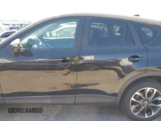 2016 Mazda CX-5 Grand Touring with VIN JM3KE4DY9G0893174, listed as a IAAI auction lot 41887814 with 79,811 mi miles. Bid and sale history available at carsss.com. Image 13.