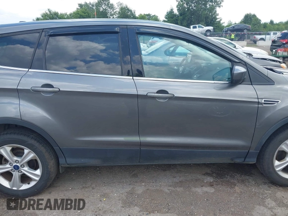 2013 Ford Escape SE with VIN 1FMCU9G95DUC01185, listed as a IAAI auction lot 42602840 with 140,697 mi miles and . Bid and sale history available at DreamBid. Image 13.