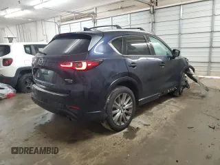 2023 Mazda CX-5 Signature with VIN JM3KFBXY9P0122887, listed as a Copart auction lot 88993465 with 12,116 mi miles and Salvage Title. Bid and sale history available at carsss.com. Image 3.