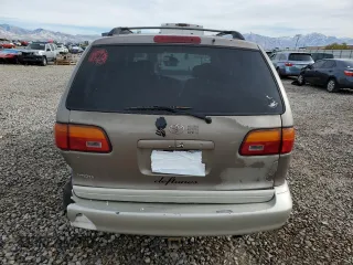 1999 Toyota Sienna LE with VIN 4T3ZF13C7XU133135, listed as a Copart auction lot 80618034 with 200,910 mi miles and Salvage Title. Bid and sale history available at carsss.com. Image 6.