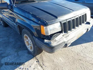 1998 Jeep Grand Cherokee Limited with VIN 1J4GX78Y8WC110325, listed as a IAAI auction lot 41357373 with 165,106 mi miles. Bid and sale history available at carsss.com. Image 17.