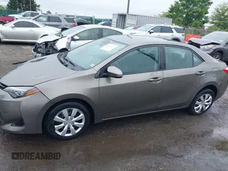 2018 Toyota Corolla L with VIN 2T1BURHE9JC990834, listed as a IAAI auction lot 42583027 with 217,143 mi miles and . Bid and sale history available at DreamBid. Image 14.