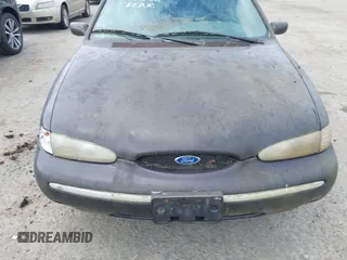 1995 Ford Contour z VIN 3FALP6633SM116313, wystawiony jako IAAI lot #42058920 z przebiegiem 192 905 mil mil oraz . Historia ofert i sprzedaży dostępna na DreamBid. Obrazek 6.