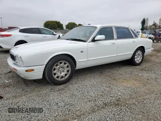 1999 Jaguar XJ with VIN SAJHX1040XC864208, listed as a Copart auction lot 59748585 with 130,577 mi miles and Clean title. Bid and sale history available at DreamBid. Image 1.