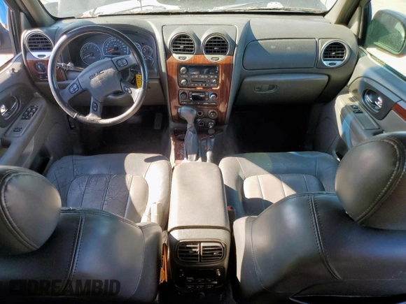 2003 GMC Envoy SLT z VIN 1GKDS13S332281271, wystawiony jako Copart lot #53685775 z przebiegiem 236 997 mil mil oraz Szkody całkowita. Historia ofert i sprzedaży dostępna na DreamBid. Obrazek 8.