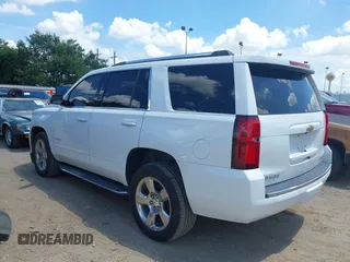 2020 Chevrolet Tahoe LTZ with VIN 1GNSCCKCXLR215899, listed as a IAAI auction lot 40128171 with 109,541 mi miles and . Bid and sale history available at DreamBid. Image 3.