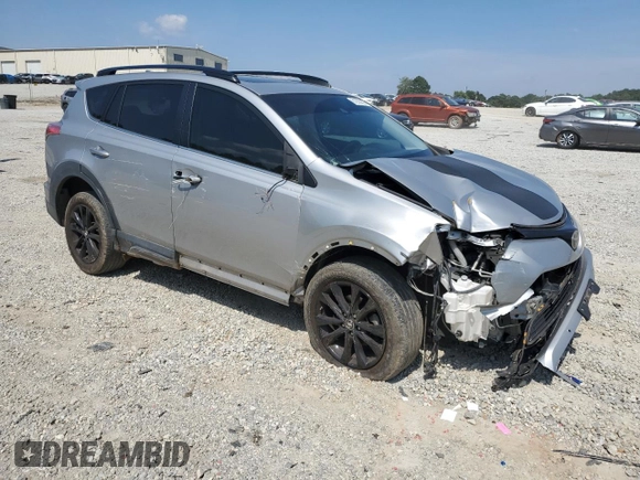 2018 Toyota RAV4 XLE with VIN 2T3WFREVXJW427748, listed as a Copart auction lot 61833055 with 104,057 mi miles and Salvage title. Bid and sale history available at DreamBid. Image 4.