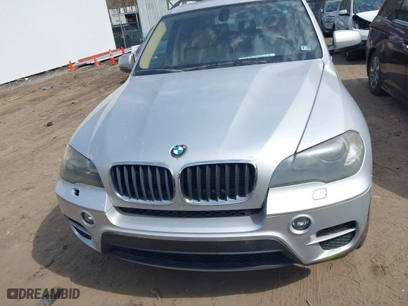 2011 BMW X5 35i with VIN 5UXZV4C53BL403476, listed as a IAAI auction lot 41820844 with 104,472 mi miles. Bid and sale history available at carsss.com. Image 6.