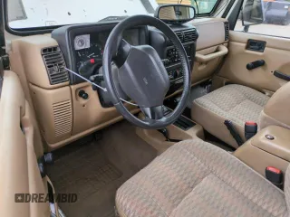 1999 Jeep Wrangler Sport with VIN 1J4FY19S2XP421162, listed as a Copart auction lot 57683835 with 152,636 mi miles and Salvage title. Bid and sale history available at DreamBid. Image 8.