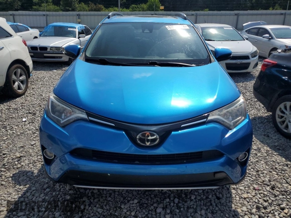 2017 Toyota RAV4 XLE with VIN JTMWFREV6HJ714920, listed as a Copart auction lot 63988704 with 61,221 mi miles and Salvage Title. Bid and sale history available at DreamBid. Image 5.