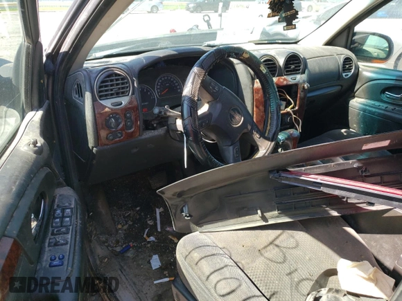 2005 GMC Envoy SLT z VIN 1GKET16M356134877, wystawiony jako Copart lot #57333345 z przebiegiem 205 714 mil mil oraz Szkoda całkowita • Salvage title. Historia ofert i sprzedaży dostępna na DreamBid. Obrazek 8.