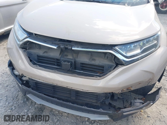 2018 Honda CR-V Touring with VIN 5J6RW1H98JL000031, listed as a IAAI auction lot 40605651 with 129,516 mi miles and . Bid and sale history available at DreamBid. Image 6.