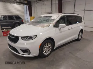 2022 Chrysler Pacifica Touring L with VIN 2C4RC1BGXNR144831, listed as a IAAI auction lot 40473026 with 36,495 mi miles and . Bid and sale history available at DreamBid. Image 2.