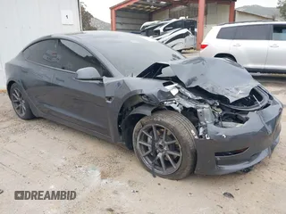 2023 Tesla Model 3 z VIN 5YJ3E1EA1PF715371, wystawiony jako IAAI lot #41799449 z przebiegiem 14 407 mil mil oraz . Historia ofert i sprzedaży dostępna na DreamBid. Obrazek 1.