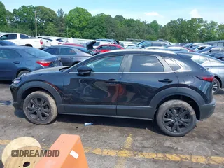 2025 Mazda CX-30 S Select Sport z VIN 3MVDMBBM3SM784464, wystawiony jako IAAI lot #42085045 z przebiegiem 1 953 mil mil oraz . Historia ofert i sprzedaży dostępna na DreamBid. Obrazek 14.