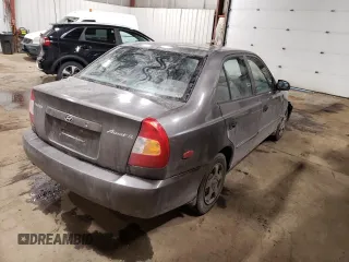2000 Hyundai Accent z VIN KMHCG45G4YU090520, wystawiony jako Copart lot #79705864 z przebiegiem 145 490 mil mil oraz Szkoda całkowita • Salvage title. Historia ofert i sprzedaży dostępna na DreamBid. Obrazek 3.