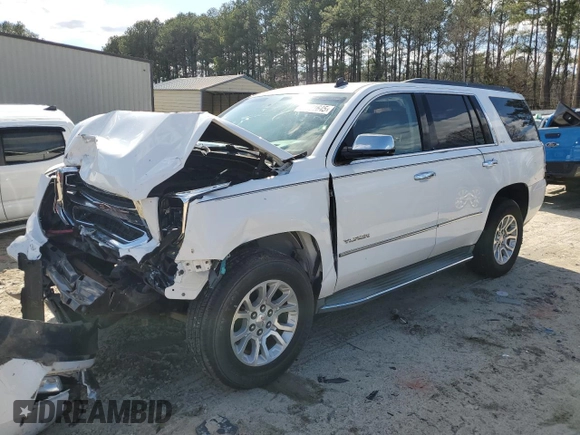 2015 GMC Yukon SLT with VIN 1GKS2BKC4FR143581, listed as a Copart auction lot 50591645 with 0 mi miles and Salvage Title. Bid and sale history available at carsss.com. Image 1.